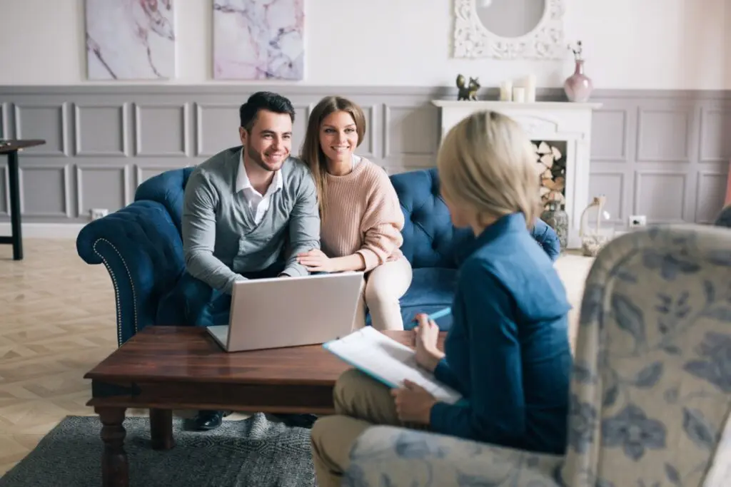 Real estate agent speaking with clients