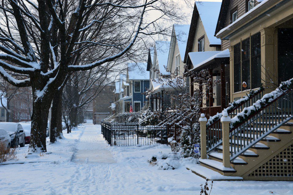Snowy sidewalk in residential neighbourhood